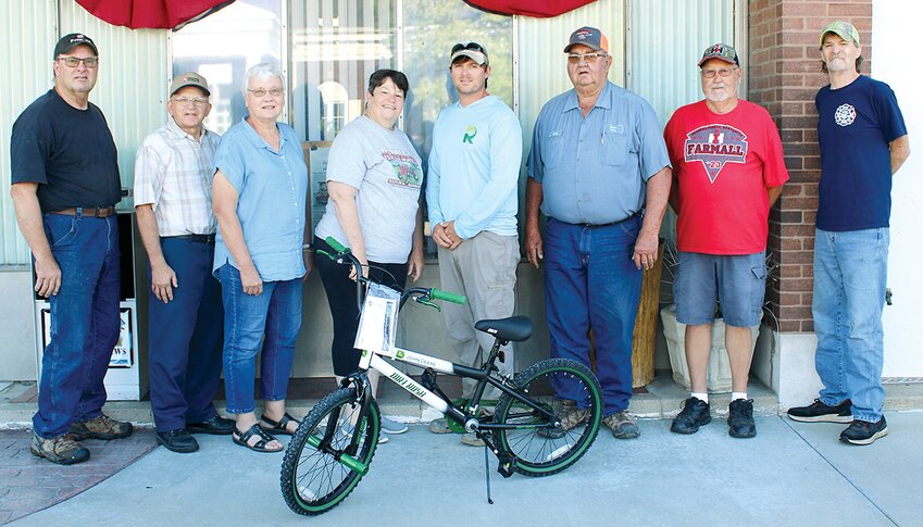 The Old Time Tractor Show is giving away a bicycle to the winner of a giveaway at Saturday and Sunday&rsquo;s show. All children present at the show are eligible to be entered in contest. Pictured above with the bike is Ed Huber, Kent Spinner, Judy Probst, Chris Huber, Caleb Randle, Arlen Kasten, Andy Theriac and Dave Randle.