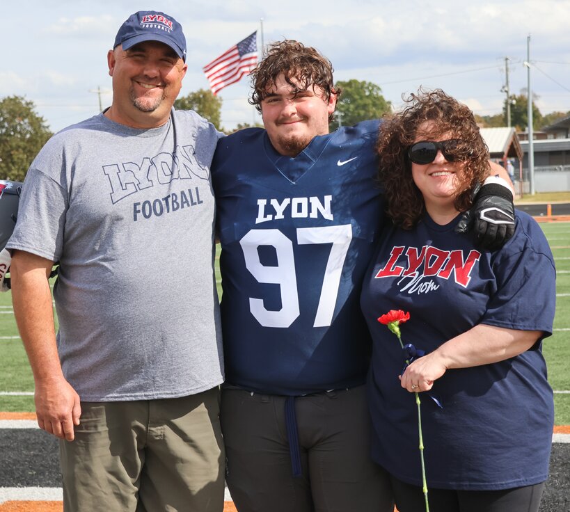 Ray Wille, pictured on senior day at Lyon Collge with his parents, Brandon and Beth Wille, swapped colleges and sides of the football during his college career, in which he made an impact on his coaches and teammates both on and off the field.
