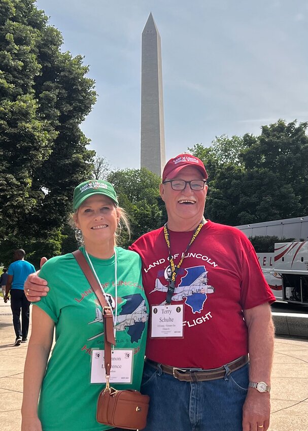 Army veteran Terry Schulte stands with niece Shannon Lawrence in front of the Washington Monument, pictured  above. Schulte was one of many veterans who took part in this year&rsquo;s Honor Flights.