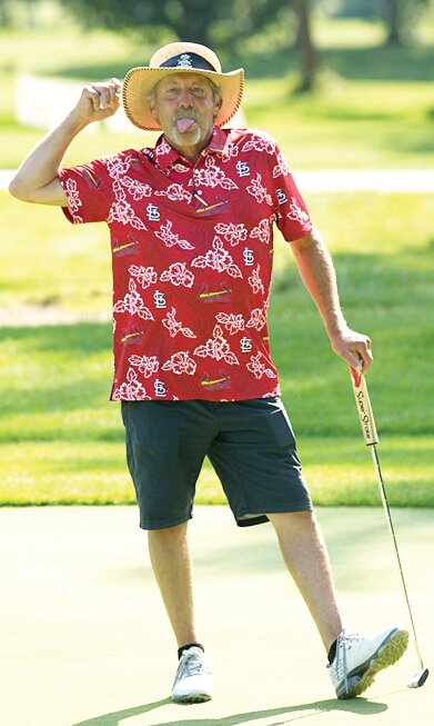 Carl Fesser mugs for the camera after sinking a putt at the Arrowhead Open on Saturday, Aug. 19, in Taylorville.