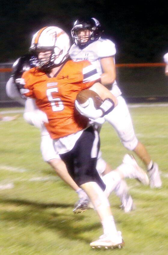 Topper running Zander Wells (#6) skirted his left end often while gaining 120 yards in only eight carries with a touchdown in Hillsboro&rsquo;s 31-6 win over North Mac on Friday, Aug. 25.