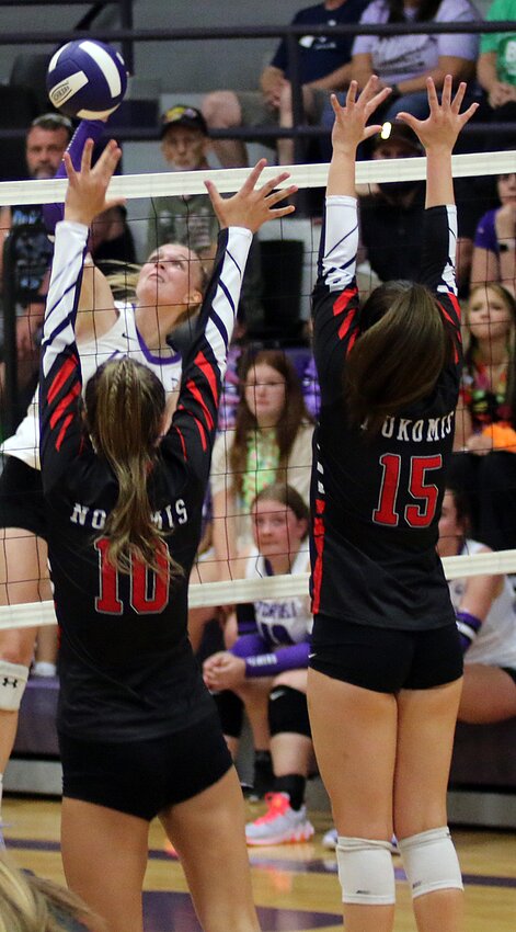 Litchfield's Annika Rhodes goes up for a kill against the block of Addison Glenn (#10) and Becca Hill (#15) during the Lady Panthers' game against Nokomis on Thursday, Aug. 24, in Litchfield. Rhodes led the Panthers with nine kills, but the Redskins were able to collect their second victory of the year in a three-set thriller.