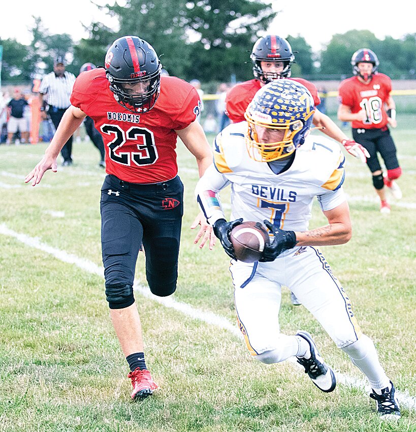 Nokomis' Drake Taylor (#23) tries to track down Villa Grove's Brady Clodfelder during the Redskins' home game on Friday, Sept. 8. Clodfelder had two touchdown receptions in the 19-12 win over Nokomis.