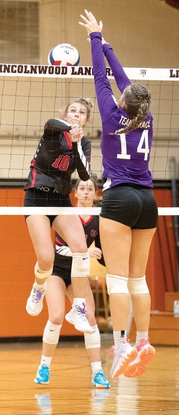 Nokomis' Addison Glenn (#10) looks for some space around the block of Hillsboro's Addison Lowe (#14) during the gold bracket semifinal between the Redskins and Hiltoppers on Saturday, Sept. 9. Hillsboro eeked out a three-set win over the Redskins, 17-25, 25-17, 15-11, but Nokomis bounced back with a win over Father McGivney in the third place game, 17-25, 25-17, 15-13.