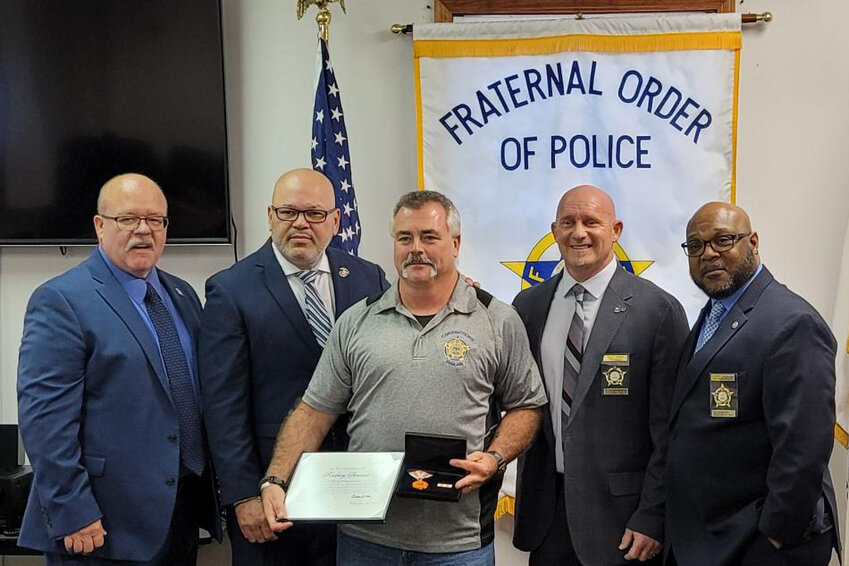 Pictured above, from left to right, Illinois FOP Corrections Lodge 263 treasurer Jay Dewitt,  second vice president Ray Gonzales, correctional officer Rodney Stewart, president Scot Ward and sergeant-at-arms Dorsey Douglas.