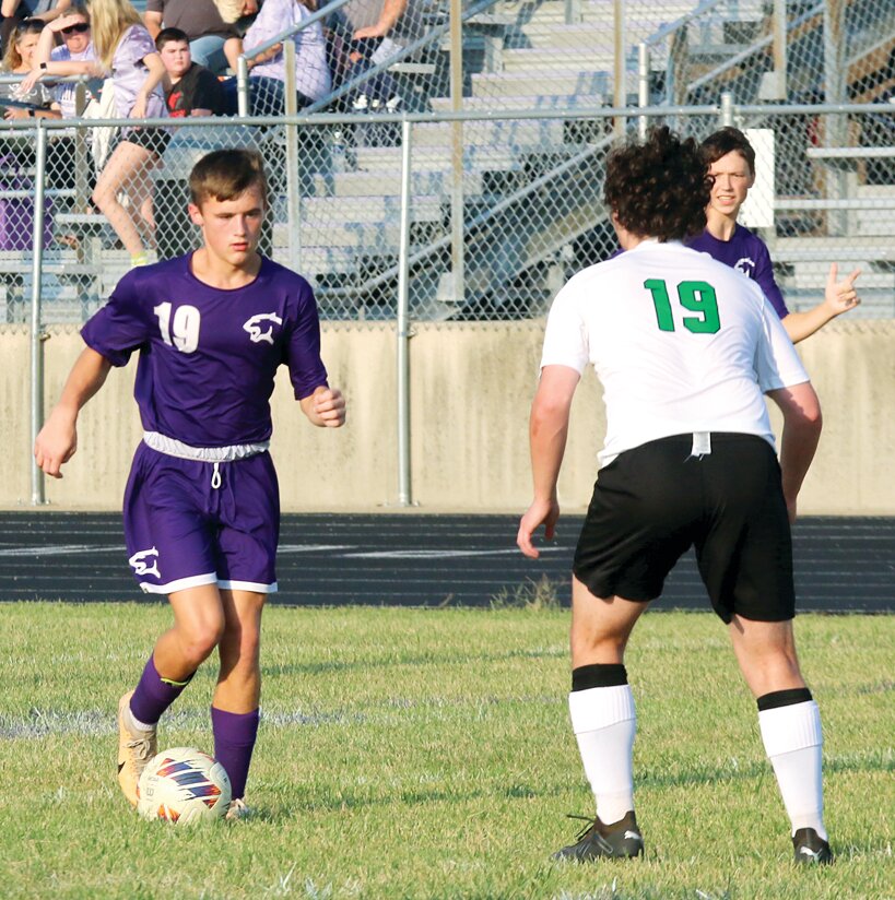 Litchfield freshman Landon Wernsing looks for an opening against the Athens defense during the Panthers' home game on Thursday, Sept. 21. Wernsing scored three goals and assisted on four of Drake Gasperson's six goals as Litchfield improved to 11-2 with a 9-0 victory over the Warriors.