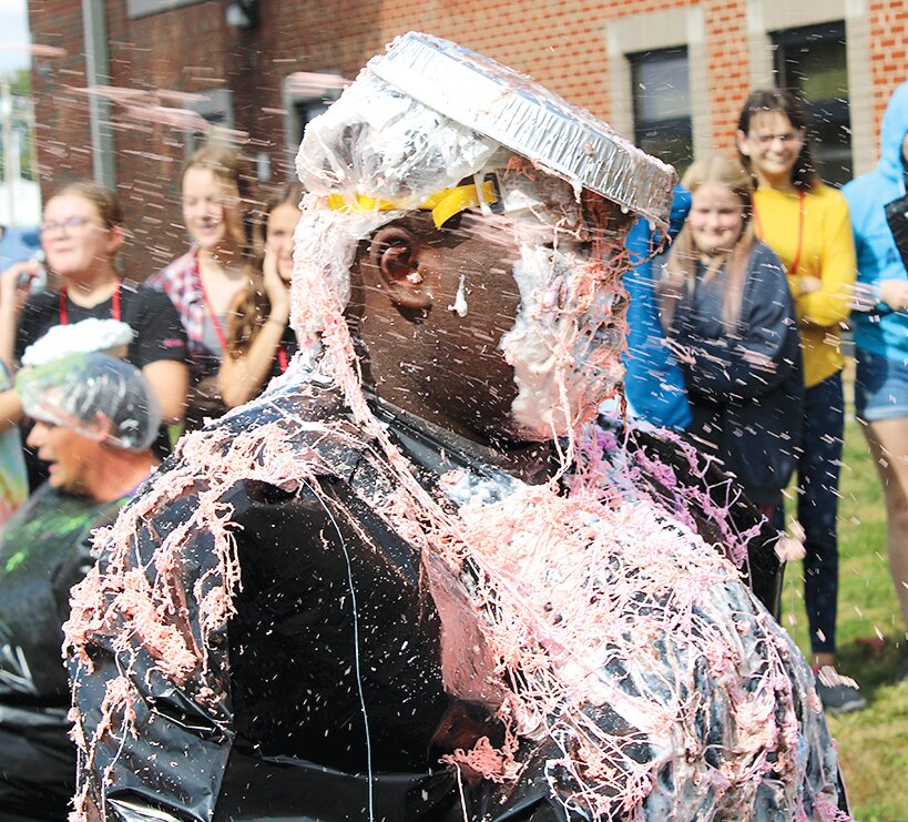 Litchfield Middle School faculty member Eddie Green was first in line to get &lsquo;pied,&rsquo; as a result of being the highest finisher in the recent 'Penny Wars' fundraiser for Gold Star Mission. Representatives from the Gold Star Mission project visited LMS on Wednesday morning, Sept. 27, to accept a donation from the Litchfield Middle School Student Council.