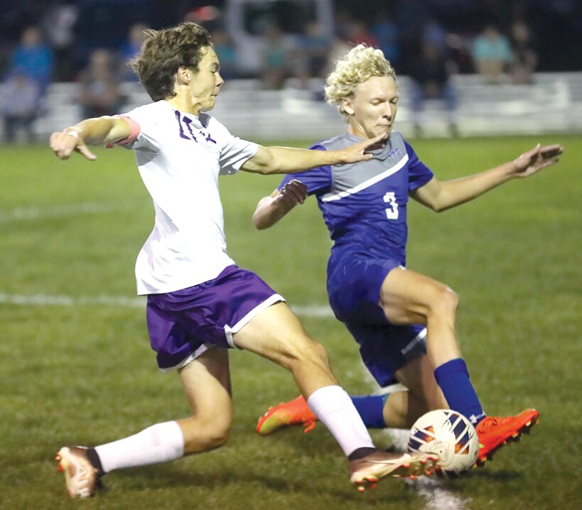 Litchfield's Drake Gasperson and Greenville's Russel Mapels vie for a loose ball during the South Central Conference showdown in Bond County on Thursday, Sept. 28. Gasperson would go on to put in the go-ahead goal in the Panthers' 3-1 win over Greenville that improved their record to 7-0 in the South Central Conference.