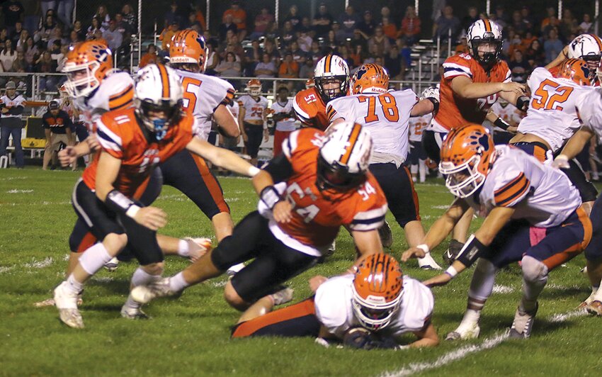 Pana managed to recover their own fumble on this play during Hillsboro's homecoming game on Friday, Sept. 29, but Toppers Seth Hubbart (#11) and Elliott Lentz (#54) were ready to pounce if the ball got away from the prone Panther. The Hillsboro defense held Pana scoreless in the second half of Friday's game, which Hillsboro won 28-21 in overtime.