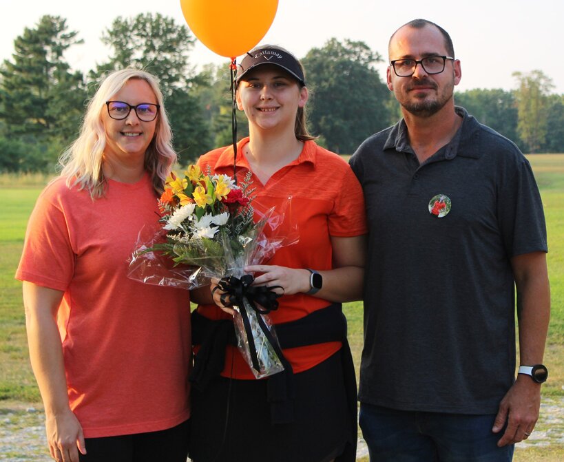 Nokomis senior Coree Keagy, pictured with her parents Angela and Brian on senior night, qualified for sectionals for the first time in her career on Thursday, Sept. 28, as she finished tied for 12th at the Effingham St. Anthony Regional at the Effingham Country Club.