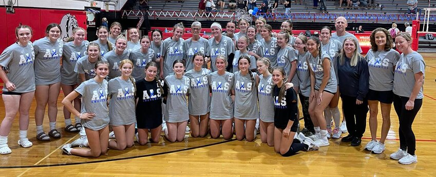 Many members of the Whitten family were in attendance for the Volley for the Cure game, and were truly honored by the support on their journey. Cheryl Whitten, back row, center, is pictured above with members of the Staunton High School volleyball team.