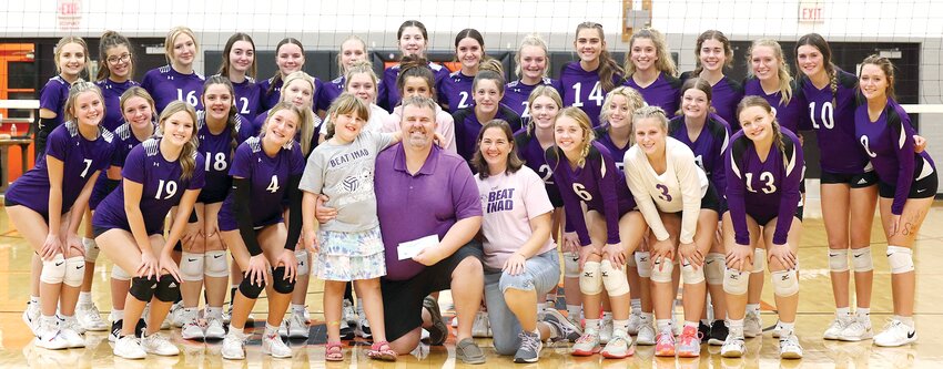 The Lincolnwood and Hillsboro volleyball teams traded in their orange and black for purple on Monday, Oct. 2, for their annual &ldquo;Grace Game.&rdquo; The two teams, along with Nokomis and Litchfield, raised more than $7,000 for INAD research from this year&rsquo;s Montgomery County Invitational Grace Tournament. In front, from the left are Ava Walton, Macie Daugherty, Charley, Kyle and Mary Herschelman, Amya Greenwood and Kennady Clayton. In the second row are Alea Wagahoft, Camryn Poggenpohl, Kinley Morris, Khloe Klinger, Taryn Millburg, Morgan Hampton, Leah Satterlee, Maycie Fuller, Reagan Lentz, Emoree Shepard and Albany Kindernay. In the back are Taryn Love, Zarah Guzman, Audrey Germann, Jazmin Seaton-Hobson, Ella Jenkins, Tori Elvidge, Kierstyn Denney, Morgan Cowdrey, Taryn Clarke, Addison Lowe, Tatum Christian, Hanna Hughes, Ellie Miller, Kearstynn Davis and Tyler Beard.
