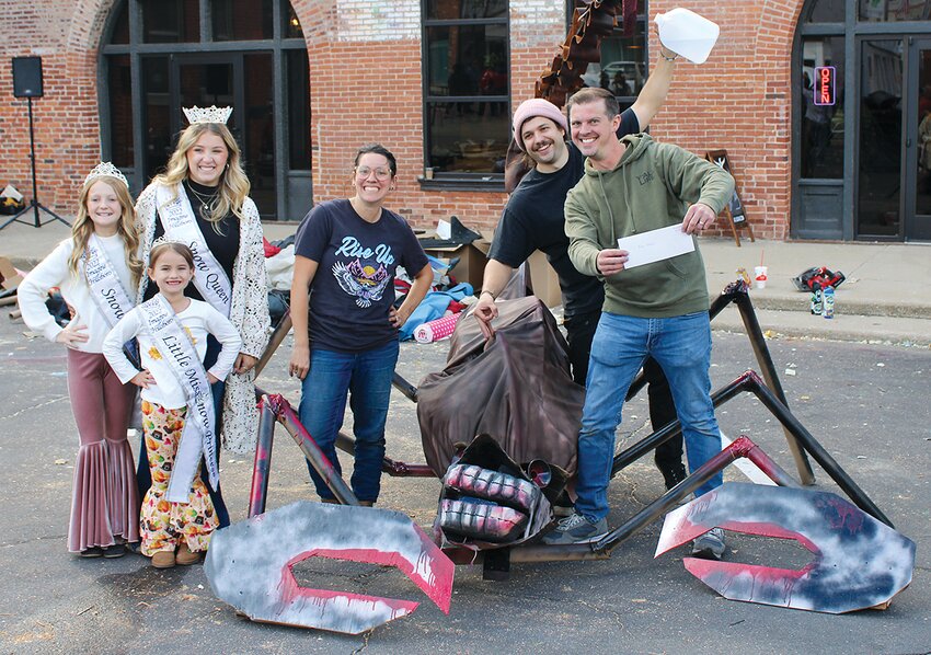After hours of building, judges awarded the $1000 first place cash prize to the team of Bri Ruppert, Isaac Reynolds and Cary Eisentraut, pictured above with their scorpion and 2022 Imagine Hillsboro Snow Pageant Queen Jade Christian, Snow Princess Hazel Holshouser and Little Miss Tinley Rufus.