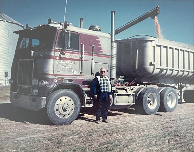 Dale Nowlan stands next to his truck after being awarded the Mid-west Truckers Association&rsquo;s December Trucker of the Month in 2000.