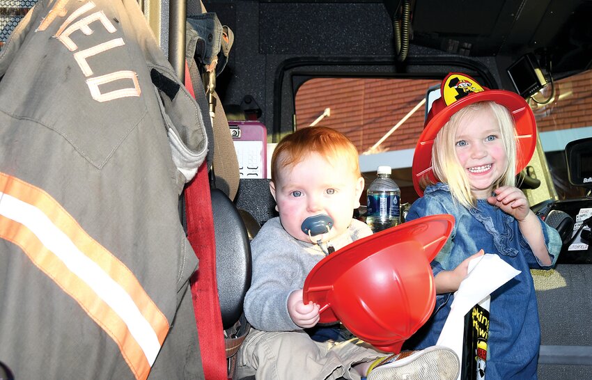 Pictured above, siblings Zaedyn Odle, age one, and Taiden Odle, age three, are all smiles sitting inside the fire truck.