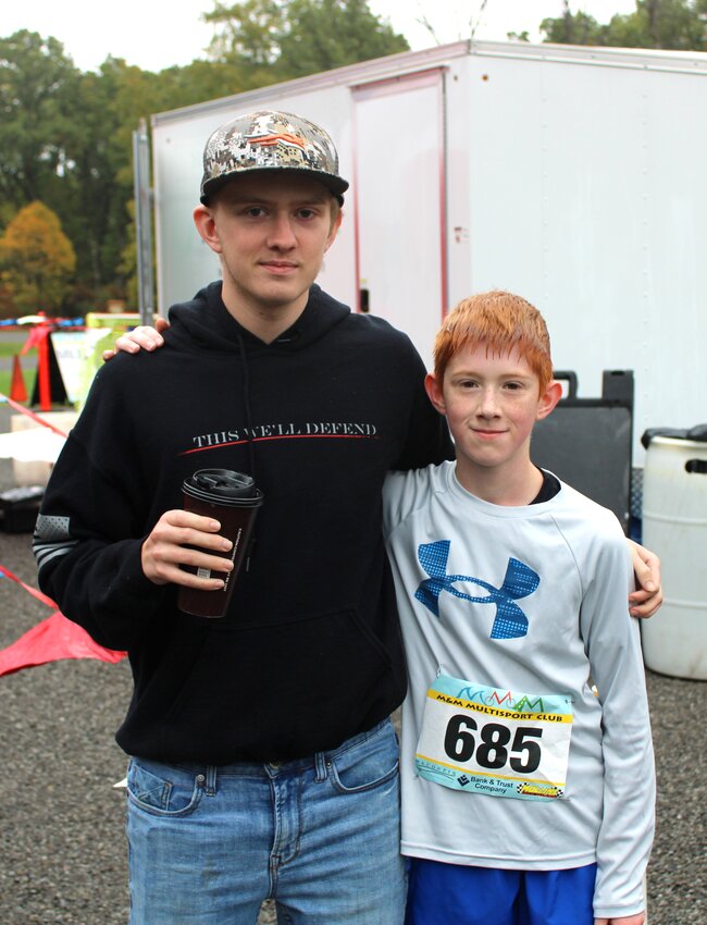 Pictured above are Aaron Roach and 10-year-old Colin Roach. Colin Roach was the first overall finisher in the 5K race, finishing in 23:57.