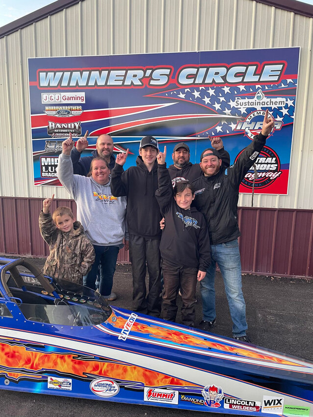 Litchfield junior drag racer Brayden Hearn made it to the winner&rsquo;s circle at the Central Illinois Dragway in Havana on Oct. 7, beating out the competition in the 12.80 class. In front are Venice Harms and Brayden Hearn. In the middle are Michelle Hearn, Timothy Hearn and Brad Gebhardt. In the back are Will Rogers of Team Live On and David Hearn.