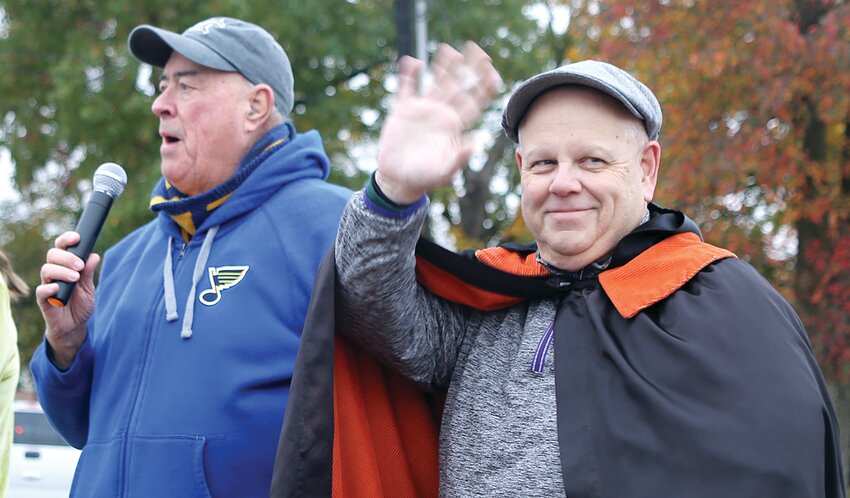 Last year&rsquo;s honoree Ed Wernsing, left, unveils 2023 veiled non-profit Mike Fleming, right, after the Litchfield Community Partners Halloween Parade on Saturday, Oct. 28.