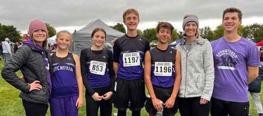 Four Litchfield Middle School runners competed in the IESA Cross Country State Finals on Saturday, Oct. 14, at Maxwell Park in Normal. From the left are Coach Jenny Schwab, Madi Betz, Maggie Schwab, Jake Wilson, Nolan Engstrom, Coach Robyn Engstrom and Coach Vincent Fanelli.