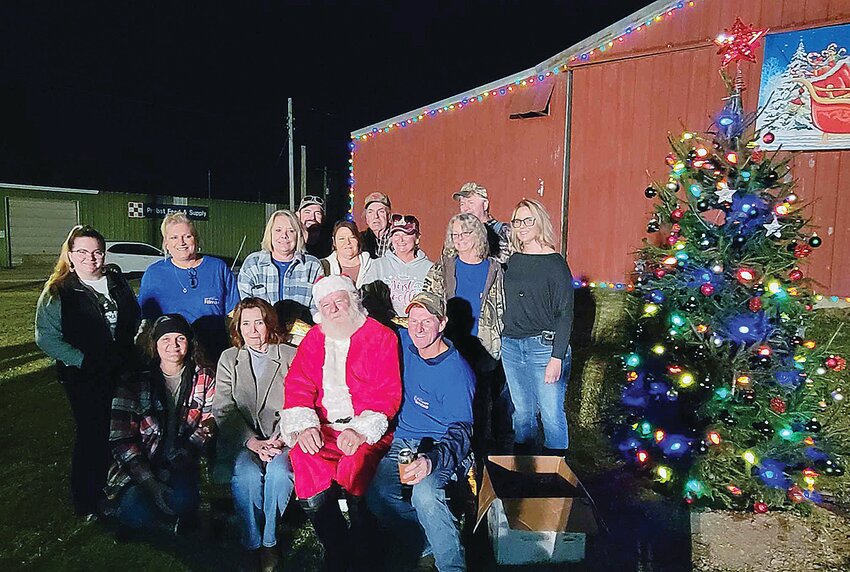 Pictured above, in front, from the left are Lisa White, Mary Harrison, Santa and Jim May. In back are Jade Lorton, Bev Slightom, Jam Merriman, Bill Schweizer, Becky King, Bob Trexler, Dawn Sampson, Sonny Sampson and Banee Ulrici.