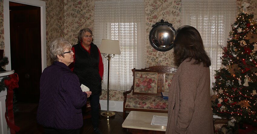 Susan Hucker, right, of the Historical Society of Montgomery County, gives tours of the Blackman/Evans House on Main Street in Hillsboro to Jane Spencer and Anne McLaughlin.