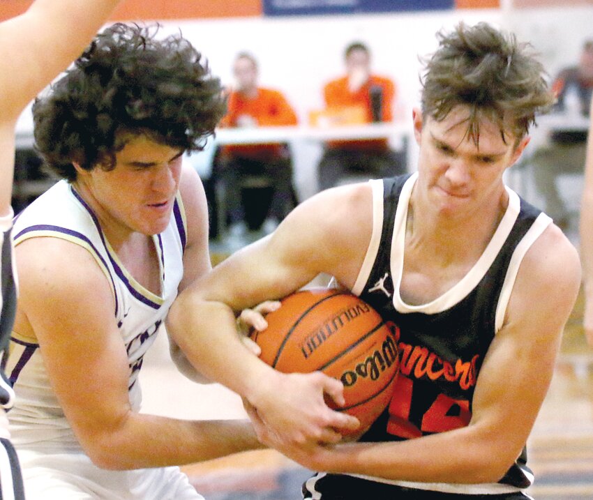 Lincolnwood's Jared Klein (right) and Jacksonville Routt's Brady Turner wrestle for possession in the second half of the Lancers' 52-33 pool play loss to the Rockets at the Gene Bergschneider Turkey Tournament in New Berlin on Nov. 22. While Lincolnwood went 0-4 at the Pretzel Dome, the loss to Routt was the only one that was by more than eight points.