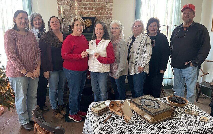 Pictured above, from the left are DAR members Mary Herschelman, Carol Calvert (who is also on the board of the Historical Society), Kendra Wright and Chris Garner and Historical Society board members Linda Zimmer, Dee Motycka, Susan Marten, Linda Guthrie and Mike Rappe. Not pictured is Patty Whitworth, regent of the Christiana Tillson chapter of the DAR.