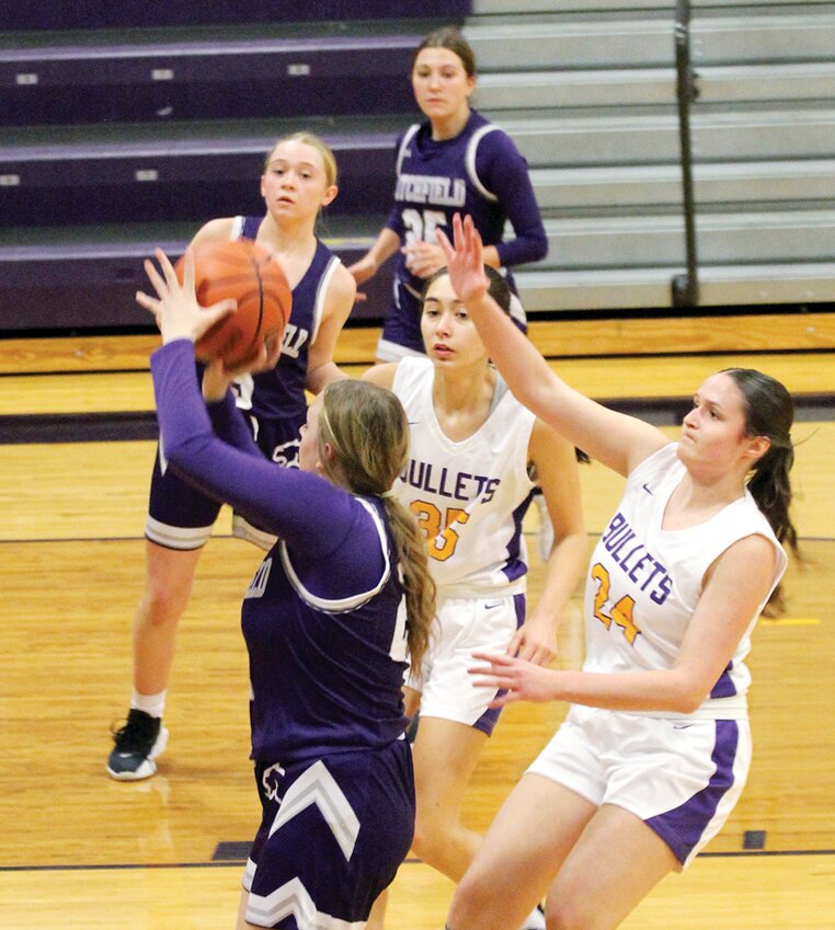 Williamsville&rsquo;s Tori Zobus (#35) and Mia Root (#24) try to catch up with Litchfield&rsquo;s Madi Jenkins as she goes up for a shot during the Panthers&rsquo; game with the Bullets on Nov. 28. Jenkins had four points in the game, which Williamsville won 52-22.