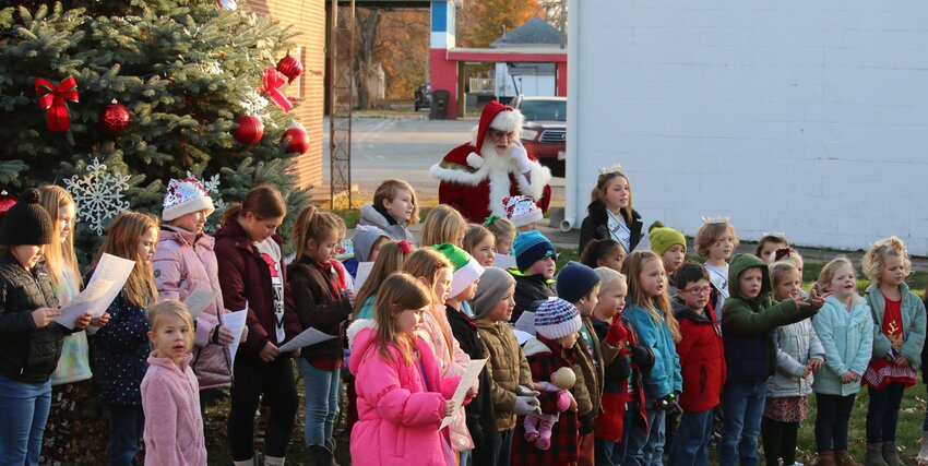 Students from the Panhandle School District got a little help from Santa Claus himself as they sang Christmas carols before the lighting of the christmas tree at Farmersville Park on the village square. The carolers, under the direction of Panhandle music teacher Sarah Weatherford, were just part of the festivities on Saturday, Nov. 25, which was presented by the Farmersville Revitalization Committee.