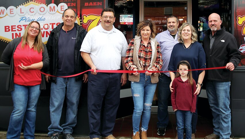 From the left are chamber Secretary Michele Orsborn, member Tom Spears, President Dr. Scott Doerr, Sunny and Red&rsquo;s employee Angie Lyerla, owners Frank and Beth Steele and daughter, Remy Steele, and chamber Treasurer Ed Chausse.