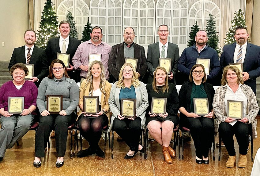 The Illinois Principals Association Kaskaskia region held their annual awards banquet on Thursday, Dec. 7. Pictured above from the left in the front row is Sally Zimmerman, Carrie Griffith, Gina Benhoff, Maria Penn, Tiffany Graham, Trista Manar and Rita Craig. In the back row is Zack Huels, Daryl Brokering, Steve Ellis, Adam Favre, Eric Swingler, Ryan Reavis and Wes Olson. Not pictured is Kyle Herschelman.