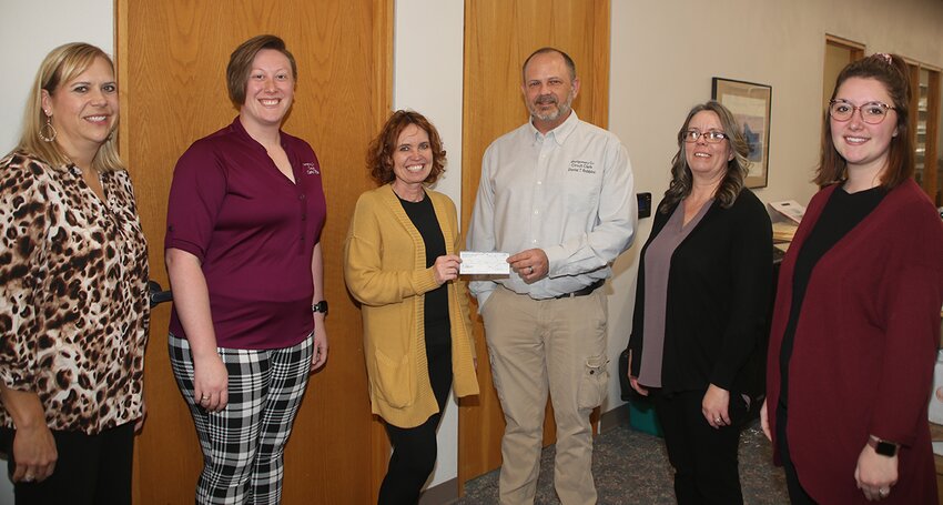Making the donation to the Angel Tree, from the left, are circuit clerk staff Stephanie Keiser and Paige Farmer, Melanie Sherer of Angel Tree, Circuit Clerk Daniel Robbins, and staff members Amy Taylor and Lakota Page.