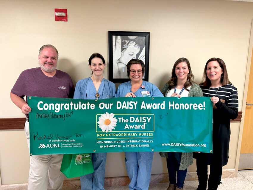 Sara Burris, RN, women and infant services (second from left), was recently named HSHS St. Francis Hospital&rsquo;s DAISY Award winner. Burris was congratulated by Jim Timpe, president and CEO, Shannon Maddaleno, RN, women and infant services manager, Heather Senaldi, RN, director of nursing and Bethany Price, RN, nursing educator.