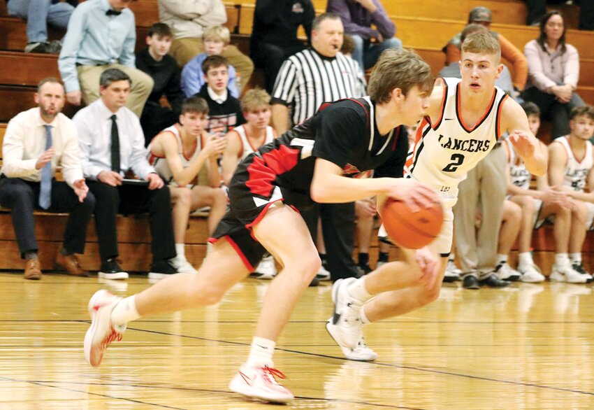 Lincolnwood's Jonah Elvidge hounds Bunker Hill guard Will Manar during the Lancers' home game against the Minutemen on Dec. 19. The Lancers' held Bunker Hill to seven points  in the second half to score a 44-26 victory over the Minutemen.