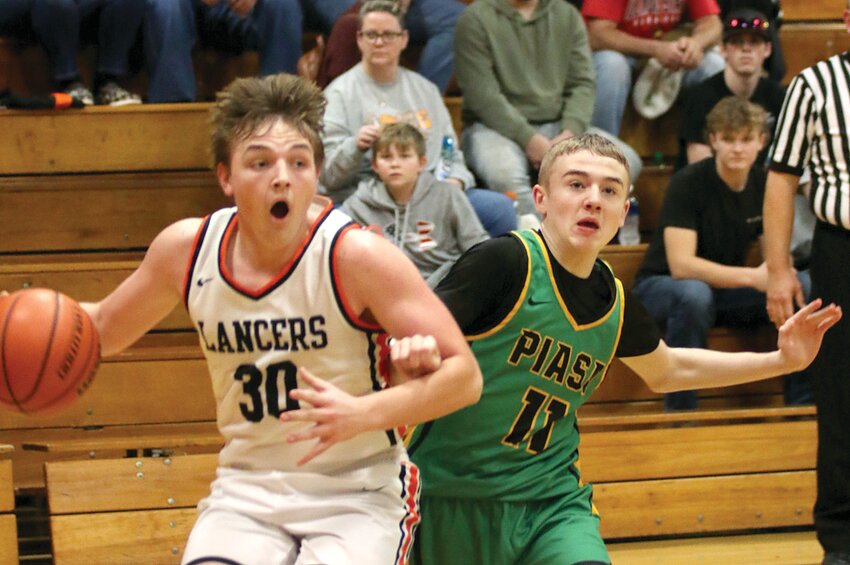 Lincolnwood's Kennady Cook (#30) drives past Cason Robinson of Southwestern during the second half of the Lancers' home game against the Piasa Birds on Saturday, Dec. 16. Cook had seven points in the Lancers' 49-43 victory over Southwestern, which improved Lincolnwood's record to 5-6 on the season.