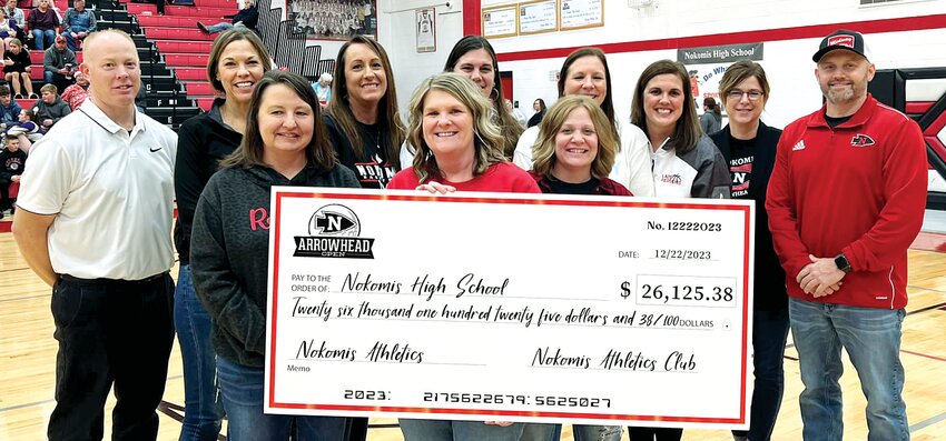 The members of the Arrowhead Open committee presented a check for $26,125.38 to Nokomis athletics on Friday, Dec. 22, the proceeds from this year&rsquo;s golf tournament. In front, from the left are Liz Engelman, Shelia Keller and Cassie Watson. In the back row are Brandon Engelman, Alycia Gillock, Mandy Swick, Bonnie Brownback, Amy Stolte, Beth King, Rachelle McDowell and Paul Watson. The funds go toward such things as equipment and camp fees for athletes, along with helping to fund Nokomis&rsquo; streaming of their basketball, volleyball and football games throughout the year on their YouTube channel.