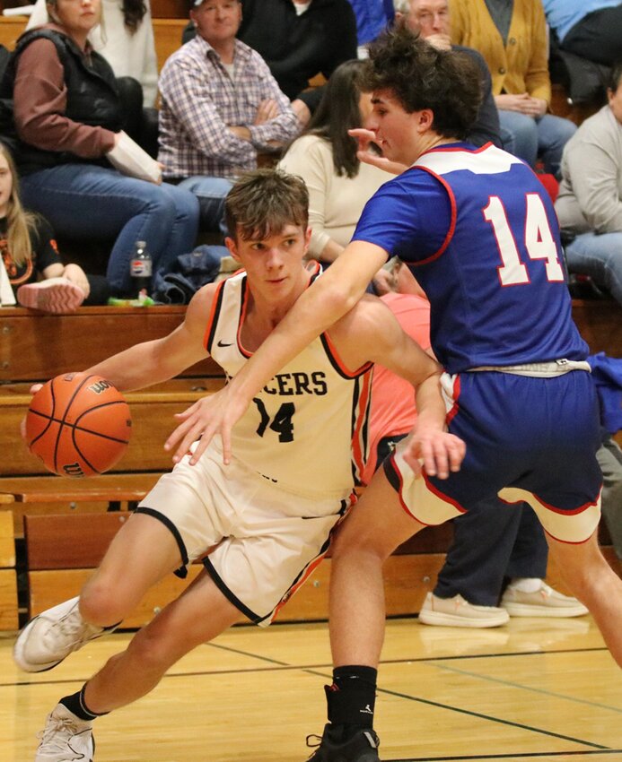 Lincolnwood&rsquo;s Jared Klein goes baseline past Pawnee&rsquo;s Cory Banister during the second half of the Lancers&rsquo; home game on Tuesday, Jan. 23. Klein had 11 points and was 5-of-6 from the free-throw line in the fourth quarter to help Lincolnwood sew up the 49-37 win over the Indians.