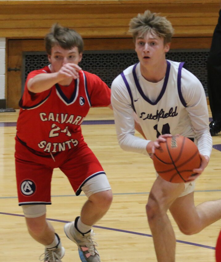 Guarded by Calvary's Kaleb &quot;Chubs&quot; Larson, Litchfield senior A.J. Odle looks for an open teammate during the first half of the Panthers' home game on Tuesday, Jan. 23. Odle had 24 points to lead all scorers on Tuesday, but a three by Larson in the final five seconds gave Calvary a 58-55 win.