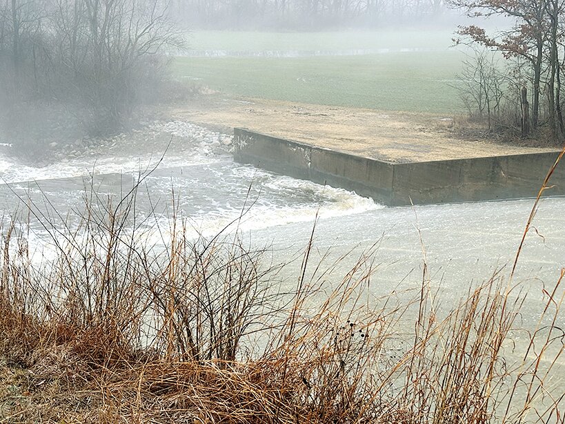 The spillway at Lake Hillsboro officially spilled over on Tuesday, Jan. 23. Winning the Imagine Hillsboro guessing contest was Bill Karban.
