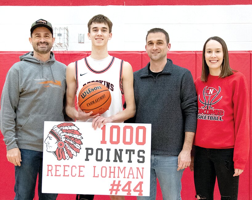 Nokomis senior Reece Lohman joined his sister Taylor and uncles Mike Havera (left) and Mark Havera in scoring 1,000 points at Nokomis High School on Saturday, Jan. 27. All told, the four have scored more than 5,000 points for their alma mater, with more than a half dozen games still to go for Reece.