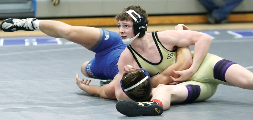 Litchfield's Braxton Kieffer looks toward the clock during his 144-pound regional championship match with Quinten Chizmar of Auburn on Saturday, Feb. 3, in Auburn. Kieffer beat Chizmar 10-6 in the match to earn his first regional championship and advance to the sectional, one of six Litchfield wrestlers to move on to Vandalia next weekend.