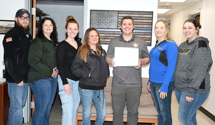 Members of the Montgomery County Sheriff&rsquo;s Office telecommunications department were nominated for an Illinois Sheriffs&rsquo; Association award for their response to the dust storm accident on Interstate 55 on May 1, 2023. Pictured above, from the left are Jeff Wilson, Stephanie Lawton, Sara Saathoff, Kara Black, Montgomery County Undersheriff Tyson Holshouser, Kay Raffety and Taylor Faure. Not present for the photo were Mary Shipman and Ed Boyd.