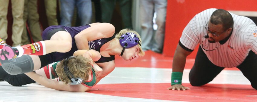 Litchfield's Vincent Moore leans in to put more leverage on the shoulder of Salem's Aden Doolen during their match on Friday, Feb. 9, at the Vandalia Sectional. Moore won that match en route to a second place finish at 106 pounds as he earned his second straight trip to the IHSA Class 1A State Tournament.