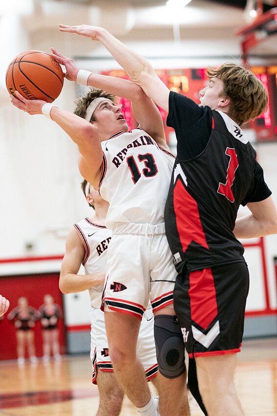Nokomis' Mason Stauder goes up for a shot against Bryce Yates of Bunker Hill during the Redskins' home game on Thursday, Feb. 8. Stauder had 12 points against the Minutemen as Nokomis picked up the 45-25 victory.