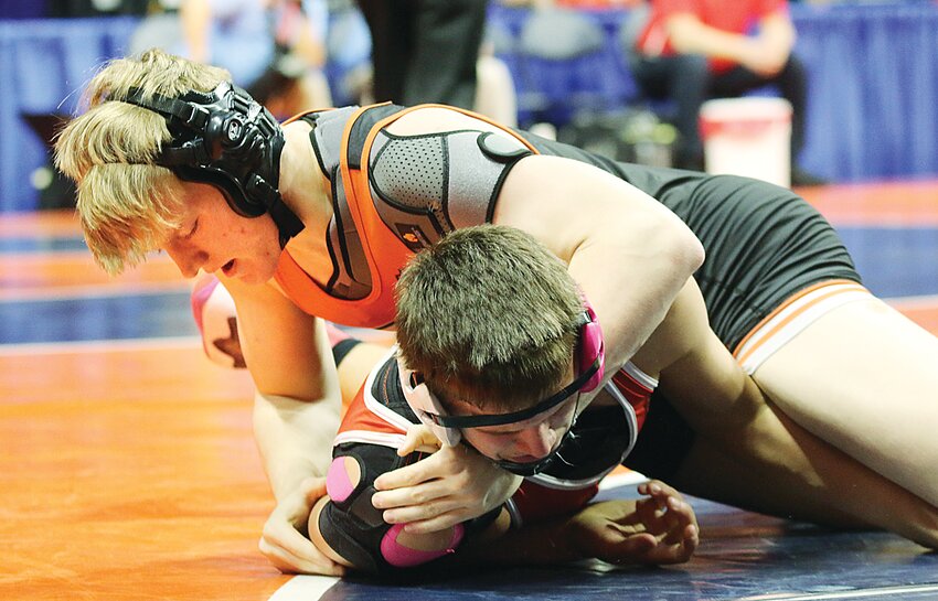 Hillsboro&rsquo;s Zander Wells tries to turn Cooper Miller of Gibson City-Melvin-Sibley during their preliminary match at the IHSA Class 1A State Wrestling Tournament in Champaign on Feb. 15. Wells was down 9-3 to Miller going into the third period when he took down the Falcons&rsquo; 165-pounder and earned the pin at the 4:17 mark of the match.