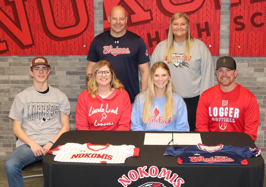 Nokomis senior Reaghan Jonas will continue her education and softball career at Lincoln Land Community College after signing with the Loggers on Friday, Feb. 23. In front, from the left are Kannon, Jennifer, Reaghan and Seth Jonas. In the back are Reaghan's coaches, Sonny Aidich of Wahoos Softball and Nokomis Head Coach Karson Gragert.