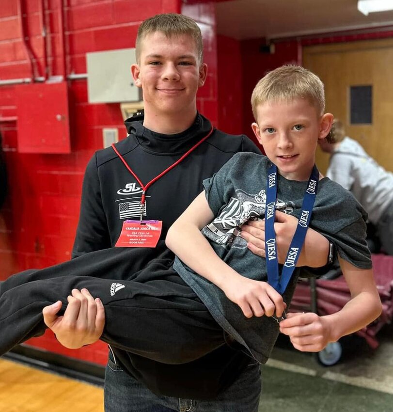 Litchfield Middle School fifth grader Jayse Ellinger gets a lift from older brother Jayden after taking second at the IESA Vandalia Sectional on March 2. The younger Ellinger is hoping to finish higher at this weekend's state tournament than his older brother