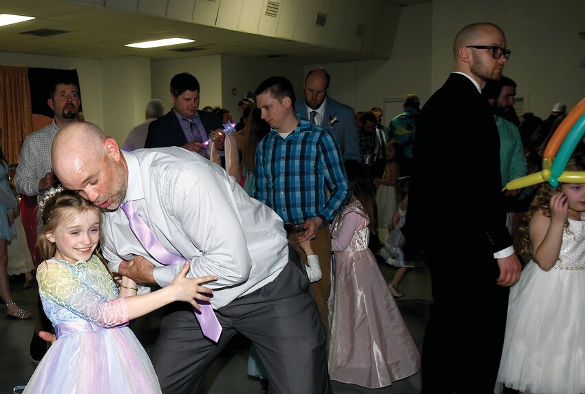 Pictured above, Nathan Estes and his daughter, Gabby, enjoy a spin on the dance floor.