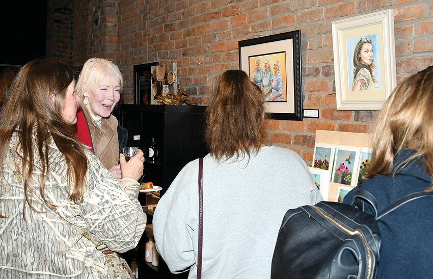 Pictured above, from the left are Annie Rieken, Linda Esker, Donna Esker and Debby Austin, as they look at artwork on display. Some of the friends came from south of Waterloo to attend the exhibit's opening. The HeARTland Gallery is located at 315 Main Street in Hillsboro.