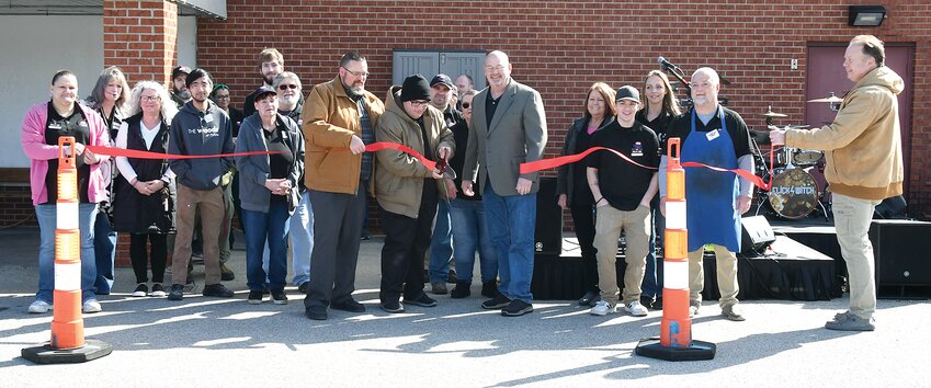 Staff members of Capri IGA in Hillsboro joined owner Tyler Morse and Hillsboro Mayor Don Downs for the official ribbon cutting of the grand re-opening on Saturday morning, March 9. Doing the official ribbon cutting honors was Capri IGA employee Jack Draper.